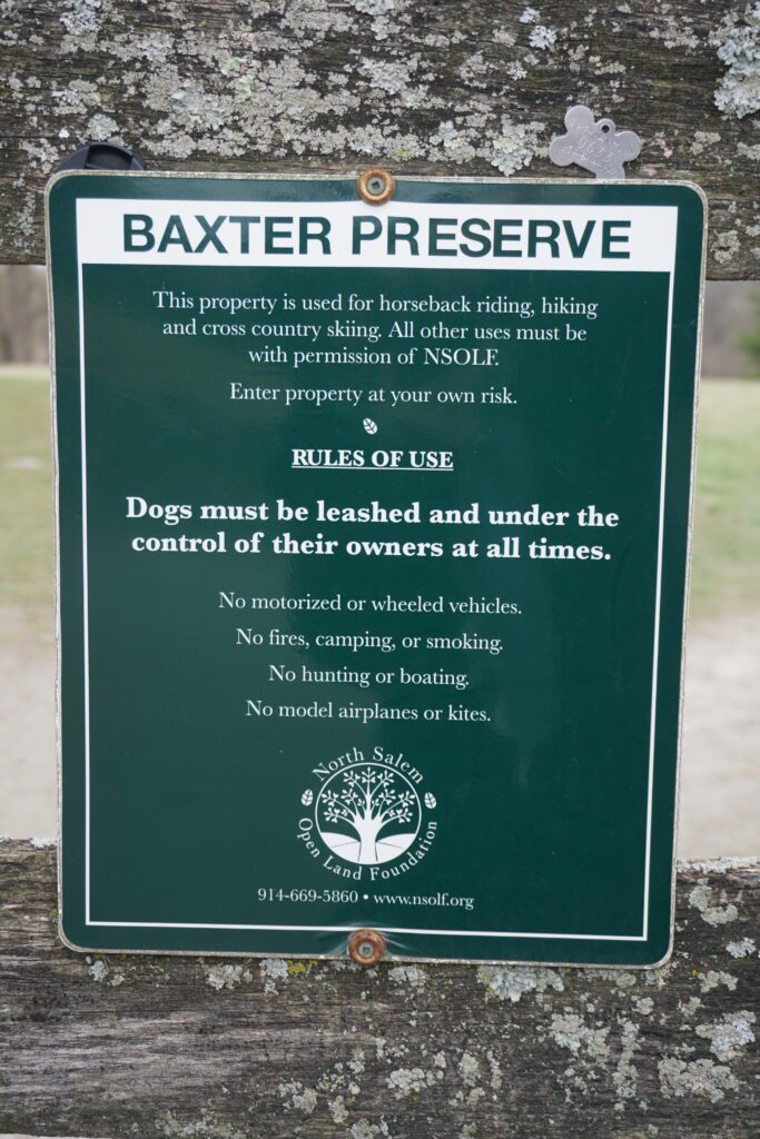 Green plaque tablet with white texts for the Baxter Reserve